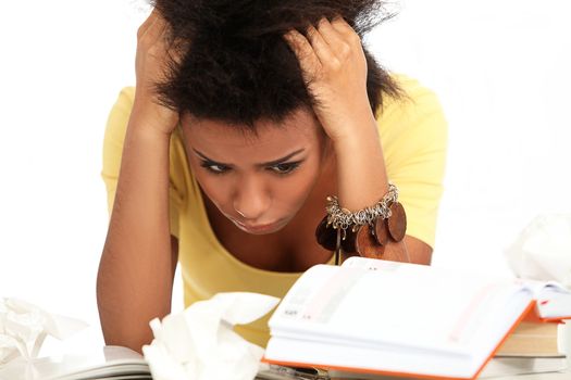 Young black woman tired from studying with books