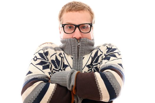 Young man in sweater feel cold over a white background