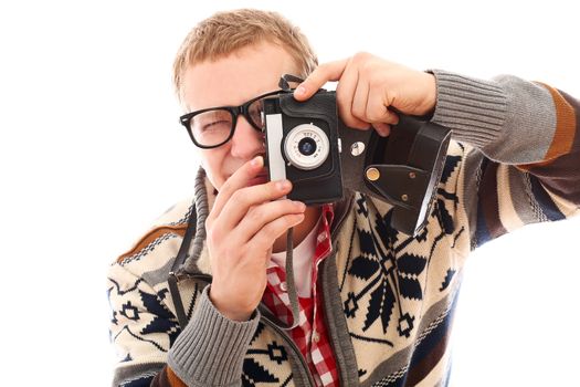 Young photographer with old camera make a photo shoot of you isolated on a white