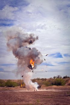 Movie EFX controlled explosion of appliance in a desert