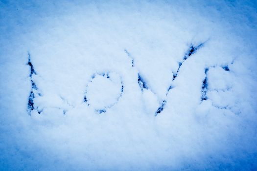 Imprint of the word love on pure snow