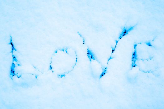 Imprint of the word love on pure snow