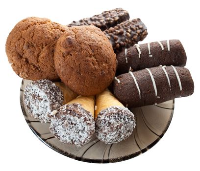 
confectionary set of oatmeal cookies, wafers, in chocolate with nuts,
wafer rolls with cream and cakes from biscuits with cocoa