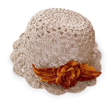 knitted baby hat, cotton thread, decorated with brown flower