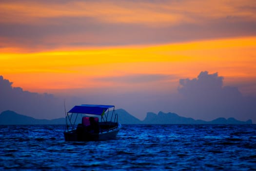 Silhouette boat in the sea