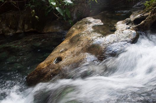 nature flow of water at hot waterfall in krabi, thailand