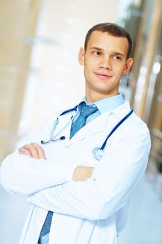 Portrait of friendly male doctor in hospital smiling