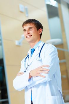 Portrait of friendly male doctor in hospital smiling