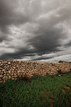 Landscape with an ancient stone wall