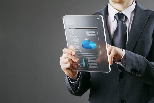 Financial Planning:businessman using a digital tablet
