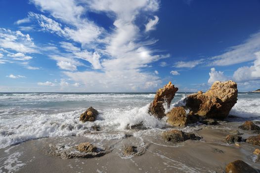 Landscape with sea and sand, white clouds in the sky