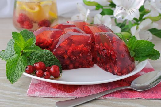 Berry jelly with fresh raspberries with red currants