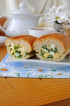 Baguette stuffed with onions and spinach with egg
