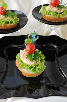 Mini sandwiches (canapés) with chicken in sesame