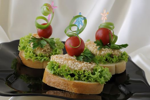 Mini sandwiches (canapés) with chicken in sesame