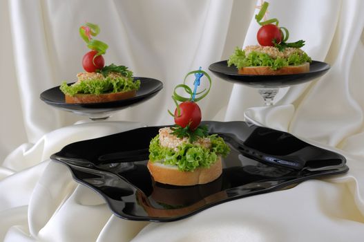 Mini sandwiches (canapés) with chicken in sesame