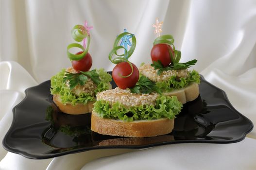 Mini sandwiches (canapés) with chicken in sesame
