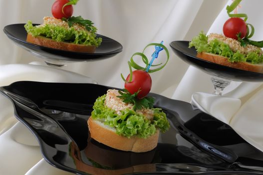 Mini sandwiches (canapés) with chicken in sesame