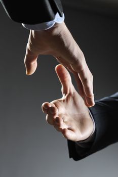 Two business men shaking hands, close up