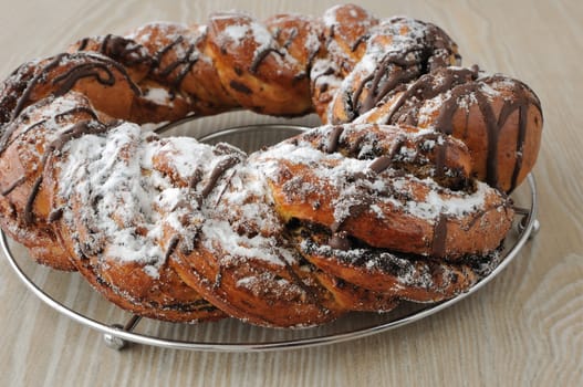 Poppy seed roll, garnished with chocolate and powdered sugar