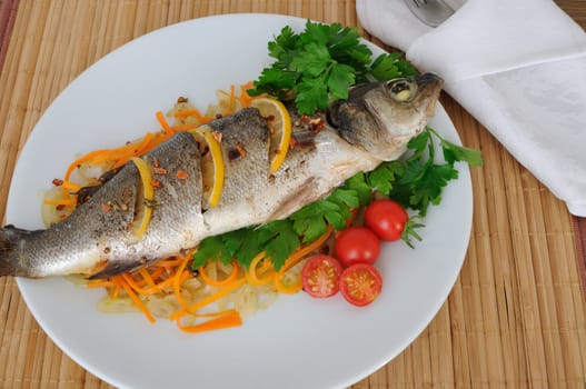 Baked trout with lemon onion and carrot on a pillow