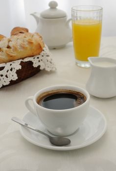 Morning cup of coffee and freshly baked pastries, juice and milk