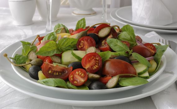 Salad of summer vegetables with basil and capers