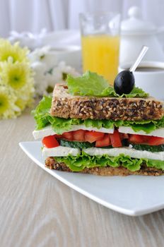 Sandwich bread with cereals, cheese, tomato and cucumber