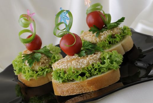 Mini sandwiches (canapés) with chicken in sesame