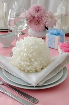 Chrysanthemum on a napkin as part of a table setting