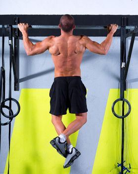 Crossfit toes to bar man pull-ups 2 bars workout exercise at gym