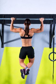 Crossfit toes to bar woman pull-ups 2 bars workout exercise at gym