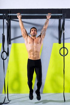 Crossfit toes to bar man pull-ups 2 bars workout exercise at gym