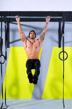 Crossfit toes to bar man pull-ups 2 bars workout exercise at gym