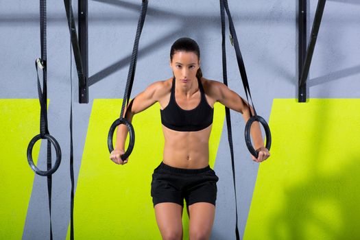 Crossfit dip ring woman workout at gym dipping exercise