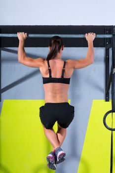 Crossfit toes to bar woman pull-ups 2 bars workout exercise at gym