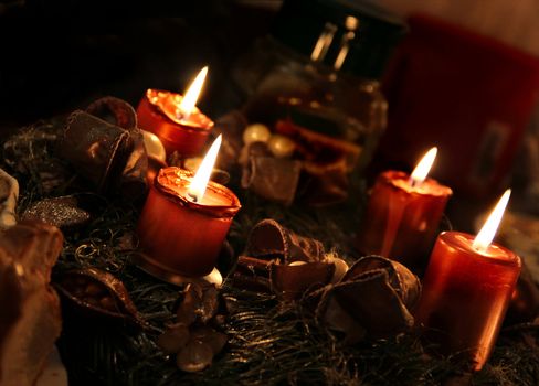 Christmas wreath and burning candles 