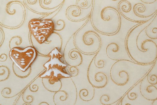 homemade gingerbreads on christmas ornament background