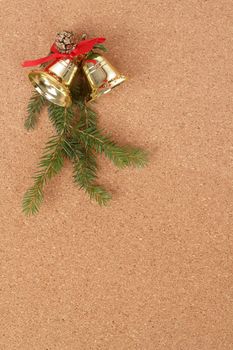 corkboard with christmas bels and needles decorations for santa message