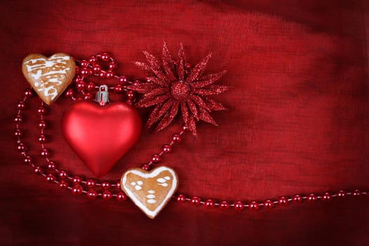 valentine heart, flower and jewelery on red background with space for text