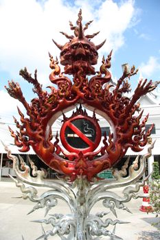 No smoking sign statue in White Temple in Chiang Rai, Thailand