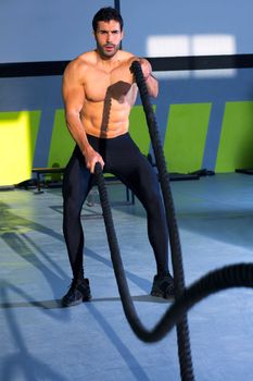 Crossfit battling ropes at gym workout fitness exercise