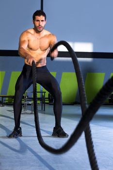 Crossfit battling ropes at gym workout fitness exercise