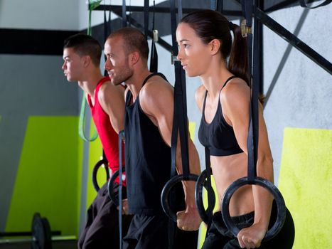 Crossfit dip ring group workout at gym dipping in a row exercise