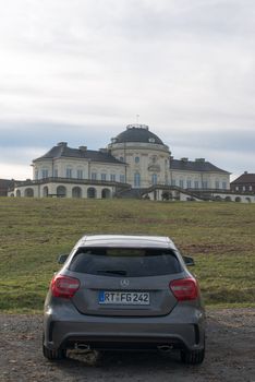 STUTTGART - NOVEMBER 21 : The new Mercedes Class A 250 AMG Sport is parked in front of Solitude Palace on November 21, 2012 in Stuttgart, Germany. The new A-Class is a complete makeover of the previous generations, the 250 AMG Sport is the largest version available, developed together with car tuner AMG.