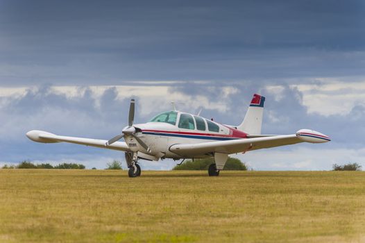 Small private single engine plane on airfield