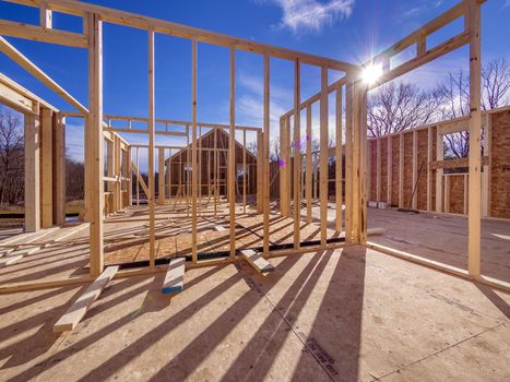 New house framing construction with studs and flooring being put up