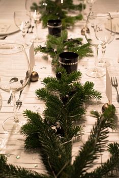 Festive XMas Table - Beautiful white, green and silver place setting for Christmas in emotional light