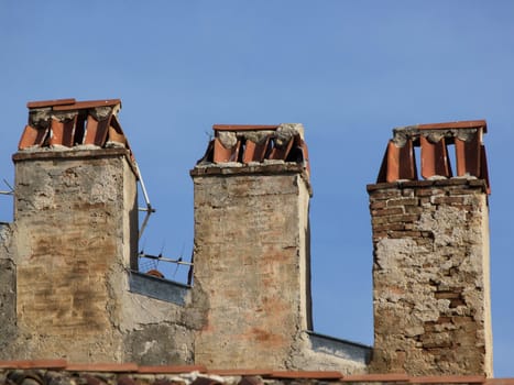 Old brick chimney stack and analogue TV aerial