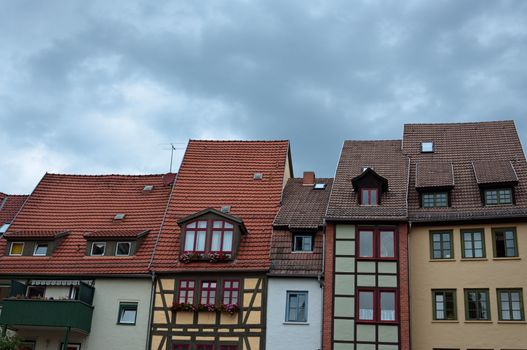 Residential apartment buildings with tiled roofs. Fachwerk traditional German style building.